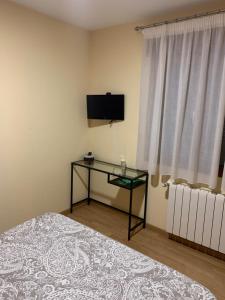 TV a/nebo společenská místnost v ubytování La Laguna