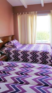 Postel nebo postele na pokoji v ubytování Harmony Motel