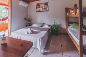 Postel nebo postele na pokoji v ubytování Pousada La Cabana