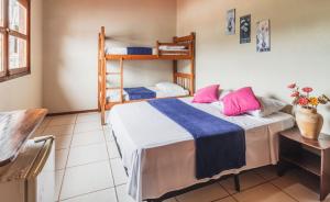 Postel nebo postele na pokoji v ubytování Pousada La Cabana