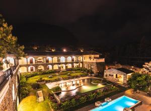 an aerial view of a mansion at night at Los Mandarinos Boutique Hotel & Spa in Valle de Anton