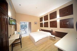 Postel nebo postele na pokoji v ubytování Hotel La Paül