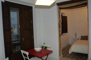 A bed or beds in a room at Santa María 12 Boutique Apartamentos