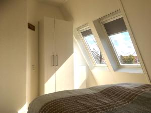 Postel nebo postele na pokoji v ubytování Bendalong Noordwijk