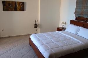 Postel nebo postele na pokoji v ubytování Sofotel