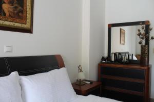 Postel nebo postele na pokoji v ubytování Sofotel