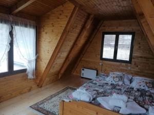Llit o llits en una habitació de Vikendica Ines