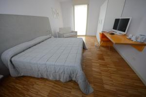 Postel nebo postele na pokoji v ubytování Stile Libero
