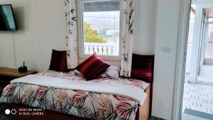 A bed or beds in a room at Perla