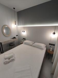 Postel nebo postele na pokoji v ubytování Stefani apartments