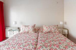 a bedroom with a bed with two pillows at LA ARMONIA in Córdoba