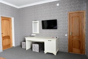 TV a/nebo společenská místnost v ubytování Central Hotel