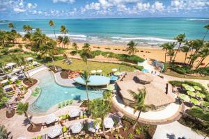 an aerial view of a resort with a pool and the beach at Margaritaville Vacation Club by Wyndham - Rio Mar in Rio Grande