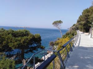a staircase leading down to the ocean on a cliff at Meridiens in Dubrovnik