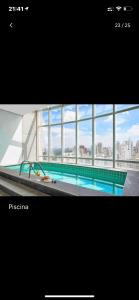 En udsigt til poolen hos Flat Lindo ao lado Park Ibirapuera Av Paulista com garagem 103 eller i nærheden
