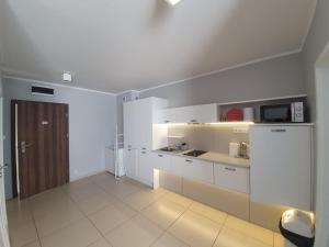 Kuchyň nebo kuchyňský kout v ubytování Baltic Cliff Apartamenty + 28 fotografií