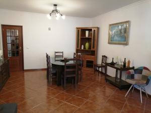 a dining room with a table and chairs at CASA DAS PEDREIRAS in Peso da Régua