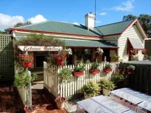 a flower shop with potted plants on a fence at Echuca Gardens in Echuca