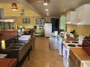 a kitchen with a sink and a counter top at Dreamcatcher Hostel in Golden