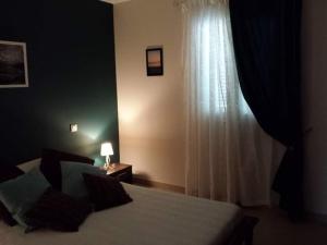 Postel nebo postele na pokoji v ubytování Coin tranquille à 2km de Saint-Florent + 12 fotografií