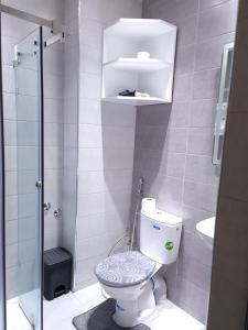a small bathroom with a toilet and a shower at Adrarhost in Agadir