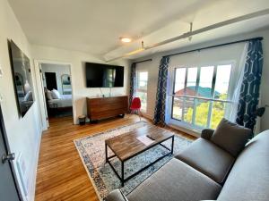 a living room with a couch and a table at The Maq Hotel in Tofino