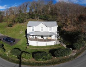 an aerial view of a white house on a hill at The Dragon's Den Downstairs Room 1 in Tazewell