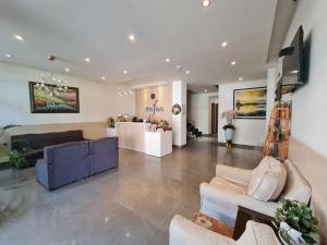 a large living room with couches and a lobby at Ngan Hoa - Mille Fleurs in Da Lat