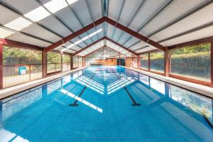 a large swimming pool with a large ceiling at Club Wyndham Ballarat, Trademark Collection by Wyndham in Ballarat
