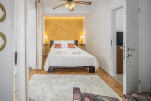 מיטה או מיטות בחדר ב-Apartments Villa Katana
