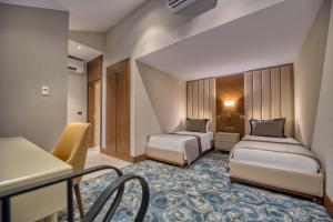 Postel nebo postele na pokoji v ubytování BN Hotel Thermal & Wellness