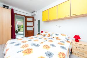 a bedroom with a bed and a window at Guest House Kuna in Dubrovnik