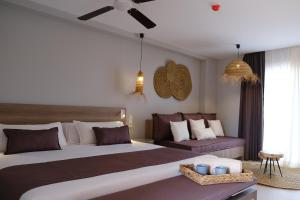 Posteľ alebo postele v izbe v ubytovaní Eques Petit Resort
