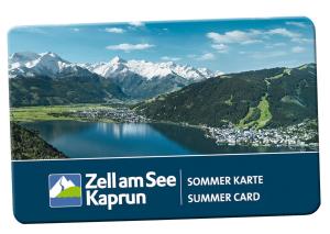 una etiqueta con una foto de un lago y montañas en Haus Ditzer - Villa Theresia, en Zell am See
