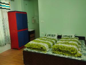 Voodi või voodid majutusasutuse Thakur Apartment toas