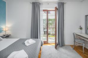 Кровать или кровати в номере Apartments Villa Katana
