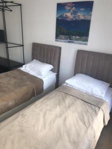 Кровать или кровати в номере Sulu Hostel