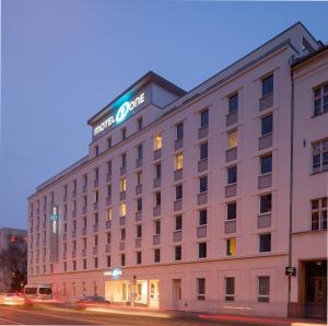 a hotel building with a sign on top of it at Motel One Berlin Mitte in Berlin