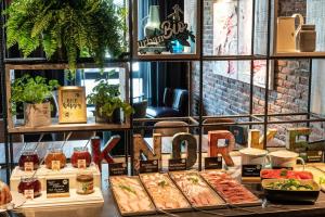 a buffet of food on a table with the word food at Motel One Berlin Mitte in Berlin