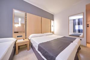 Posteľ alebo postele v izbe v ubytovaní Hotel Faro Salazón