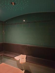 a bathroom with a bench with towels on it at Autenrieder Gästehaus Schlossbräu in Autenried +27 photos