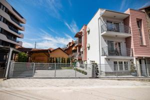 a building with a fence in front of it at Villa Misija in Ohrid