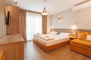 Postel nebo postele na pokoji v ubytování Villa Misija