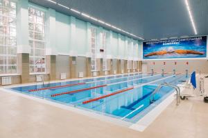 a large swimming pool in a building at База отдыха "Ветлуга" in Shar'ya