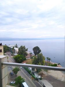 a view of the ocean from the balcony of a building at Tiberias 1 in Tiberias