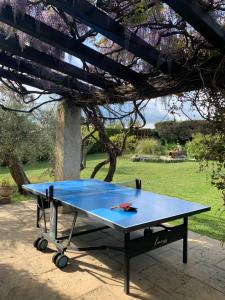 a ping pong table sitting on a patio at Mas de Pascalette in Montauroux