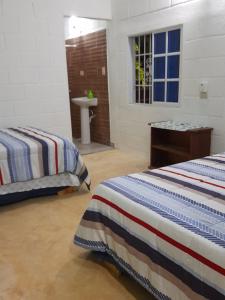 Postel nebo postele na pokoji v ubytování Wake up to a Bello Amanecer Hacienda Lopez Espino