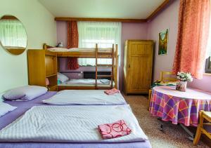 Postel nebo postele na pokoji v ubytování Holiday House Rokytnice