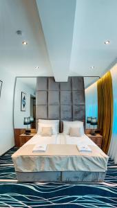 Ένα ή περισσότερα κρεβάτια σε δωμάτιο στο Hotel Vertigos