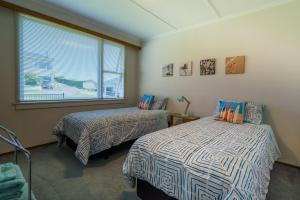 Un pat sau paturi într-o cameră la Riverton Views
